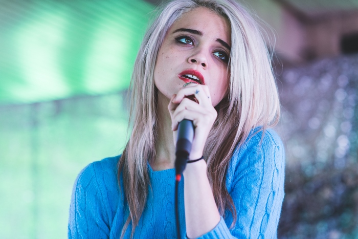 Sky Ferreira singing into a microphone