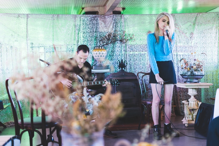Sky Ferreira performing live with a guitarist