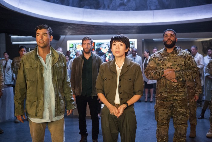 Zhang Ziyi and military personnel in a futuristic room