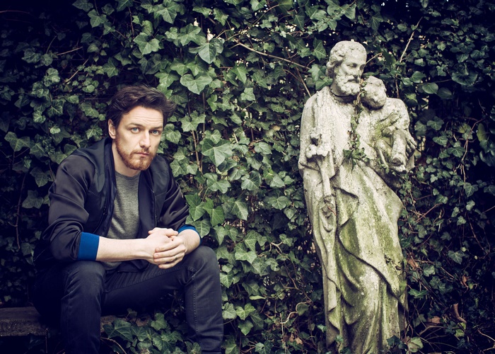James McAvoy sitting near a statue