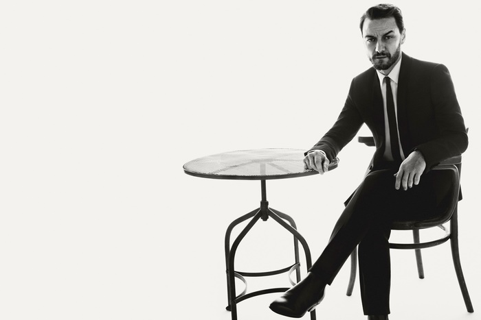 James McAvoy sitting at a table