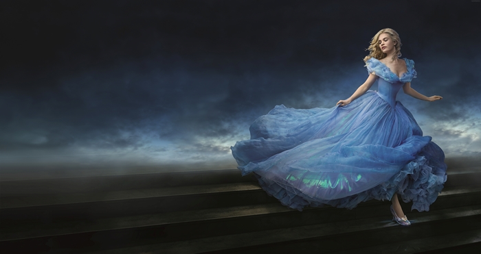 Lily James as Cinderella on stairs