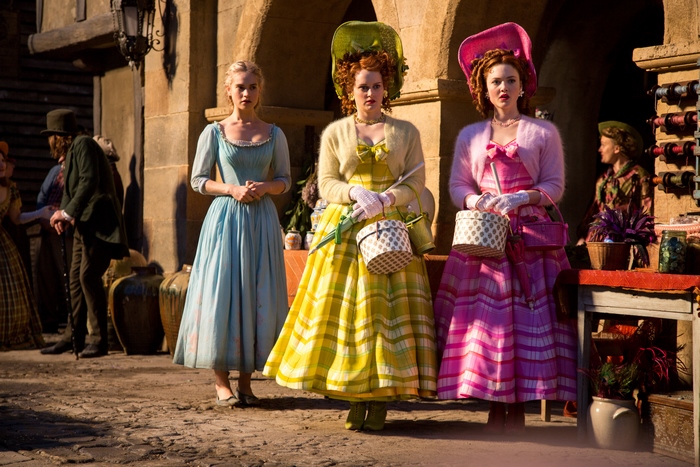 Cinderella and her stepsisters in colorful dresses