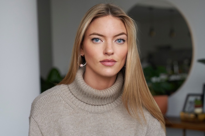 Martha Hunt wearing a turtleneck sweater