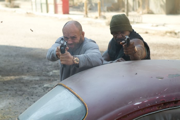 Randy Couture and man with guns