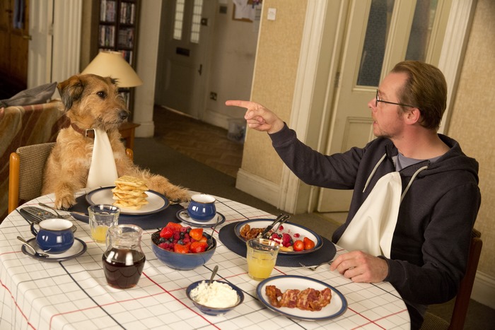 Simon Pegg and dog at breakfast table