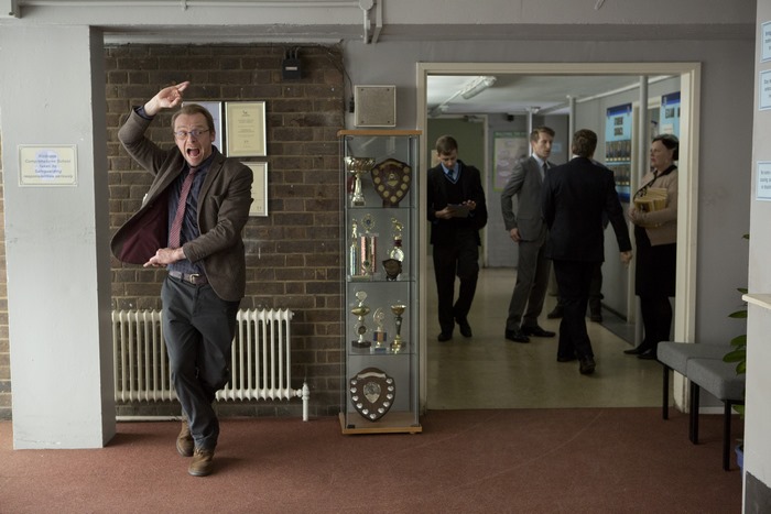 Simon Pegg in a school hallway