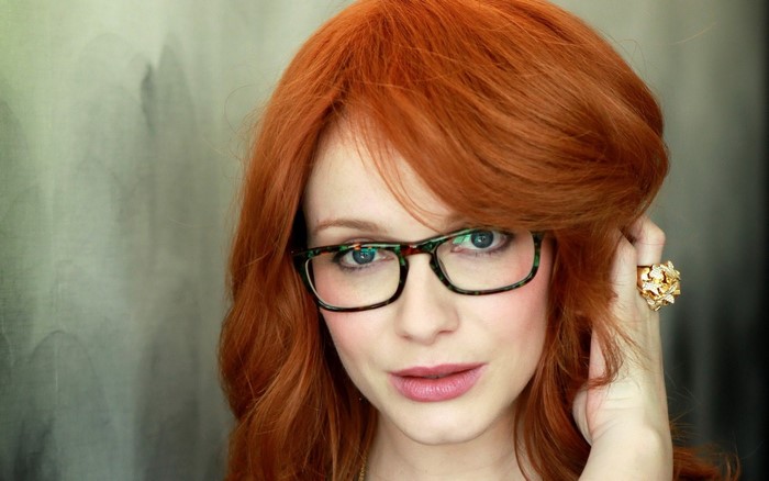 Christina Hendricks wearing glasses and a ring