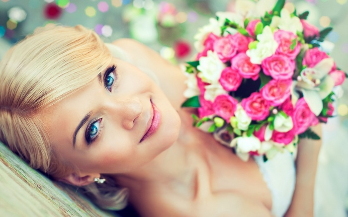 Bride with bouquet of pink and white roses