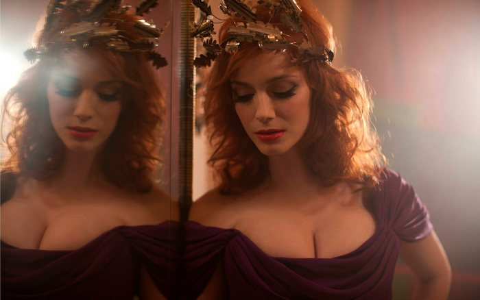 Christina Hendricks wearing a crown and purple dress