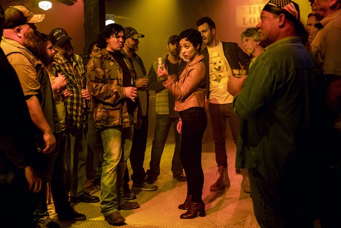 Joseph Gilgun and group in bar