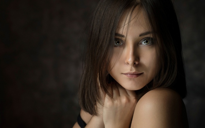 Woman with dark hair and green eyes