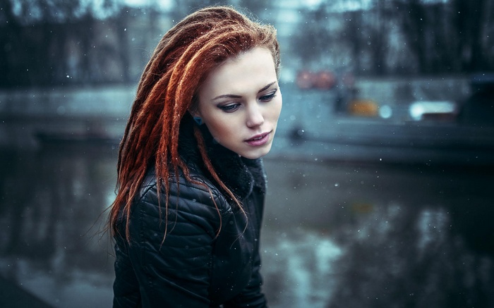 Woman with dreadlocks in the snow