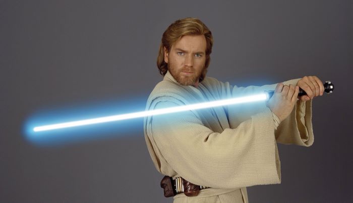 Ewan McGregor as Obi-Wan Kenobi with a lightsaber