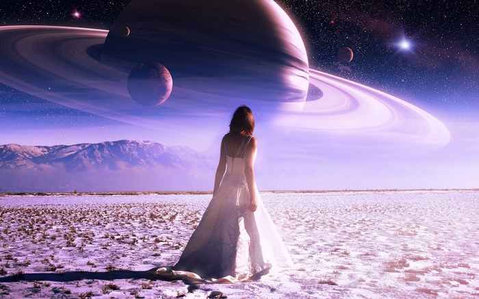 Woman in white dress on alien planet with Saturn-like planet