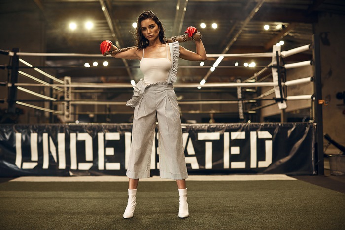 Olivia Culpo in boxing ring with boxing gloves