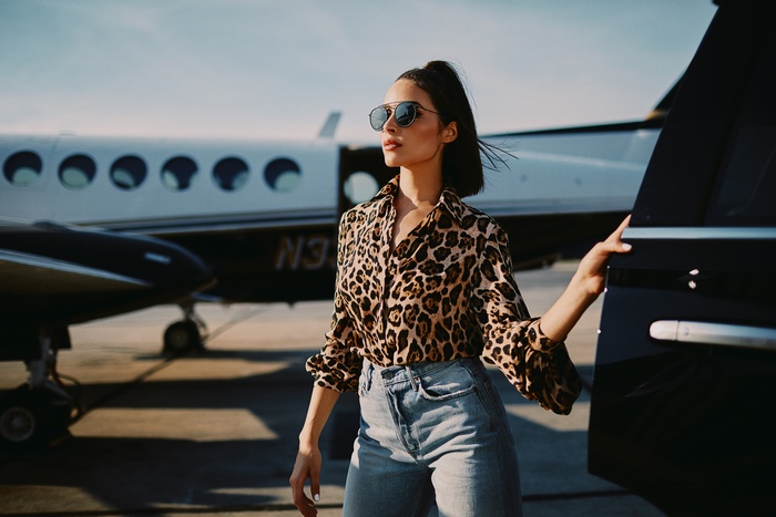 Olivia Culpo by a private jet