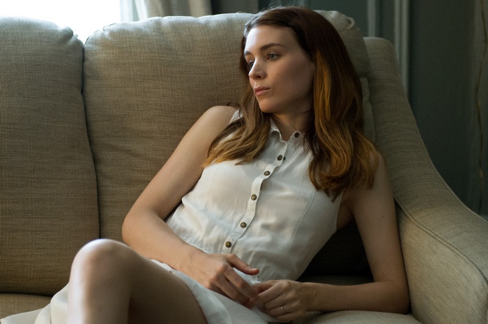 Rooney Mara sitting on a couch