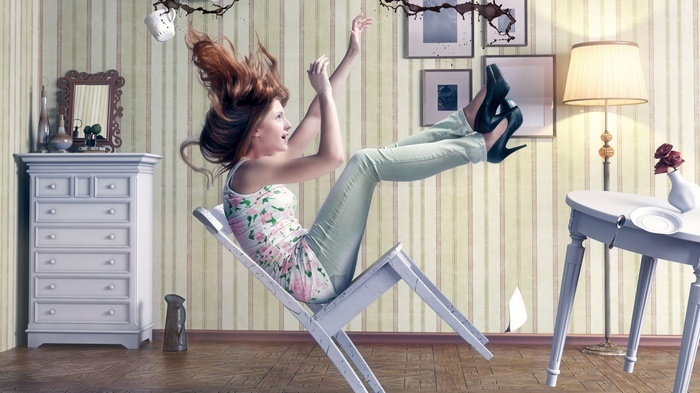 Woman falling from a chair with spilled coffee