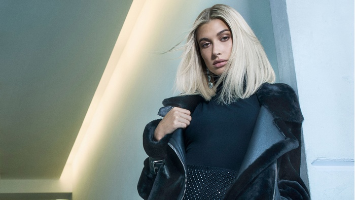 Hailey Baldwin in black outfit and fur jacket