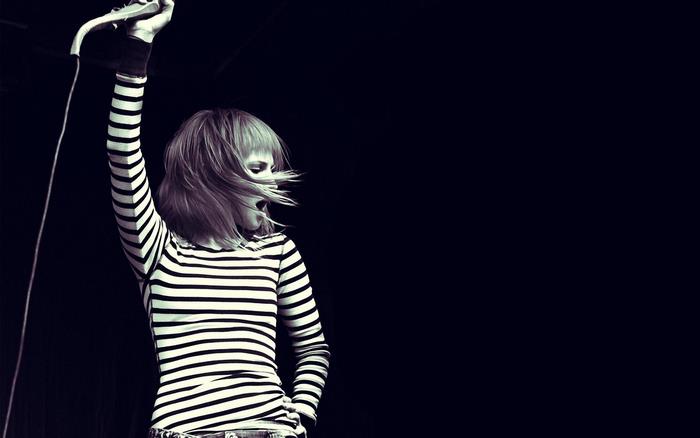 Hayley Williams performing with microphone