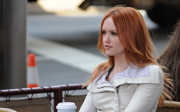 Woman with red hair wearing a jacket