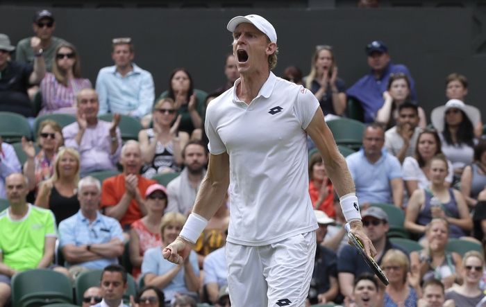 Kevin Anderson celebrating on a tennis court