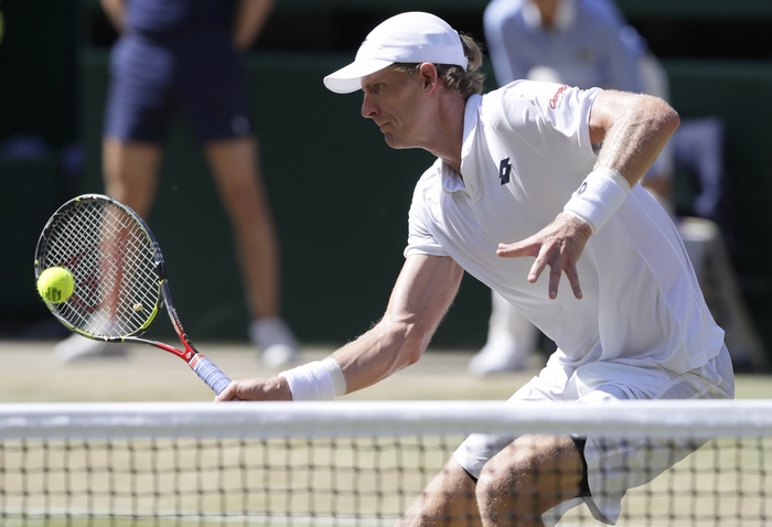 Kevin Anderson playing tennis at Wimbledon