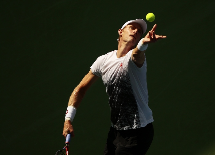 Kevin Anderson serving a tennis ball