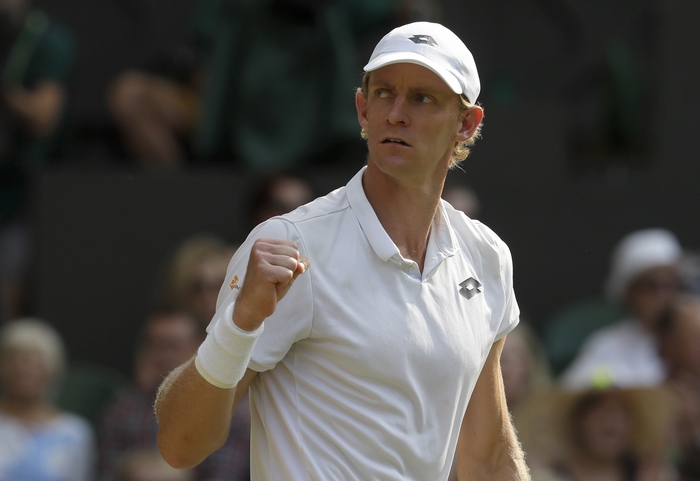 Kevin Anderson playing tennis at Wimbledon