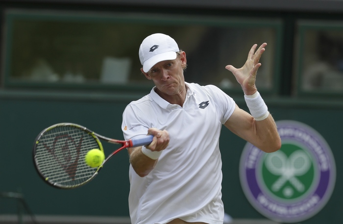 Kevin Anderson playing tennis at Wimbledon