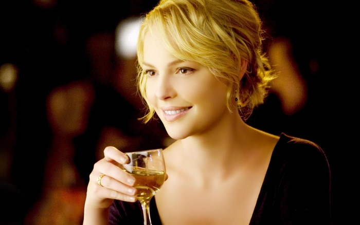 Katherine Heigl holding a glass of wine
