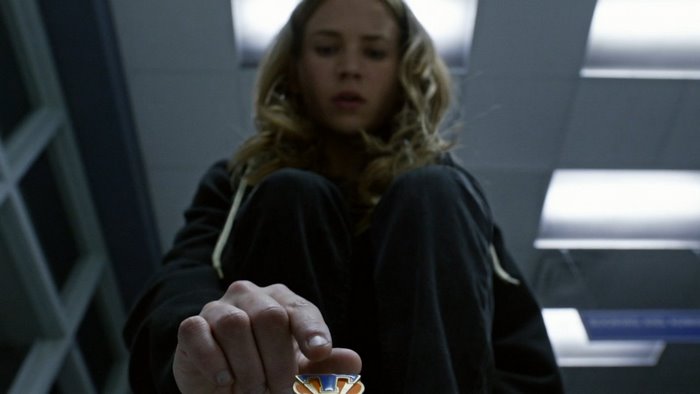 Britt Robertson holding a medal