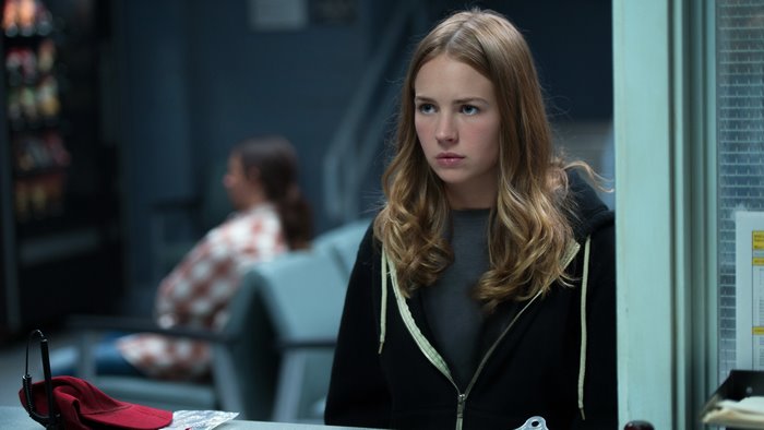 Britt Robertson in a black hoodie