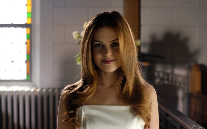 Isla Fisher in a white dress