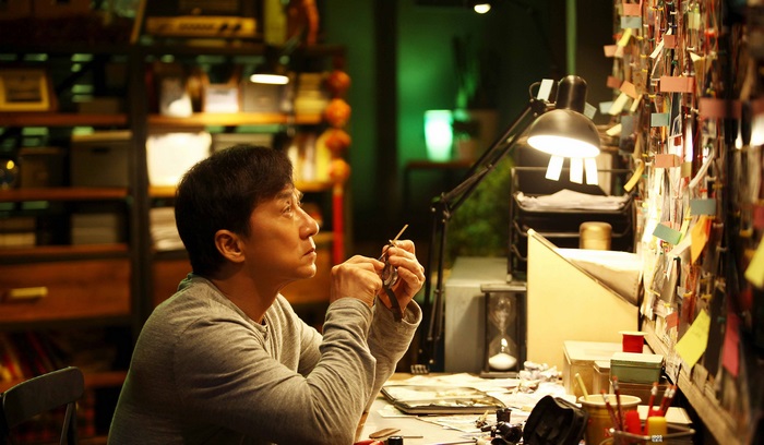 Jackie Chan working at a desk