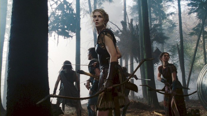 Rosamund Pike and Amazon warriors in a forest