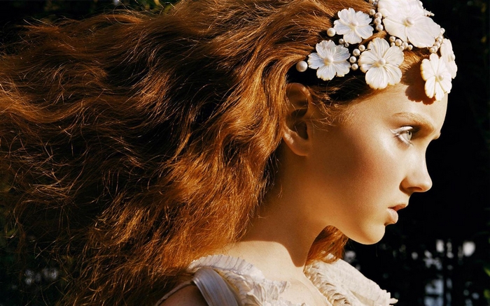 Lily Cole with floral hair accessory