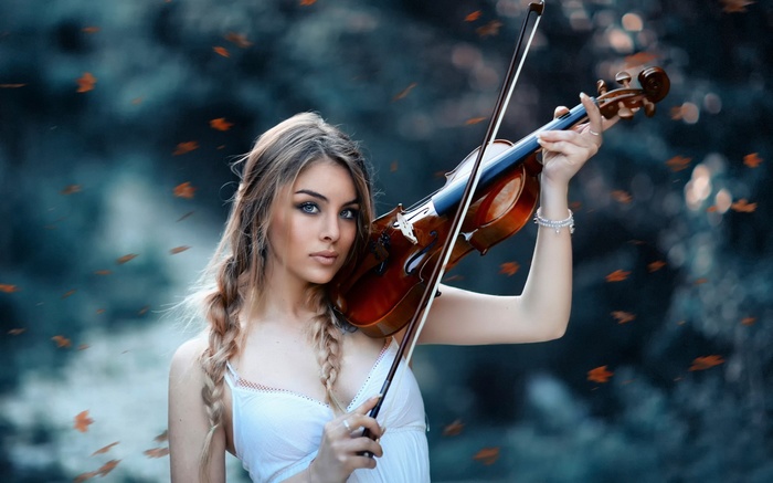 Woman playing violin outdoors