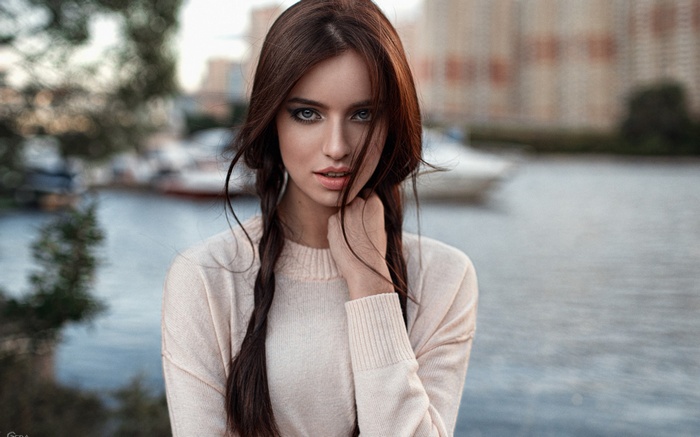 Woman with braided hair by the water