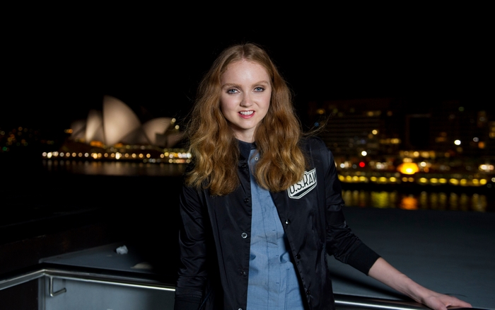 Lily Cole in front of Sydney Opera House at night