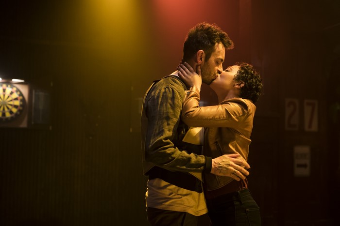 Ruth Negga kissing a man