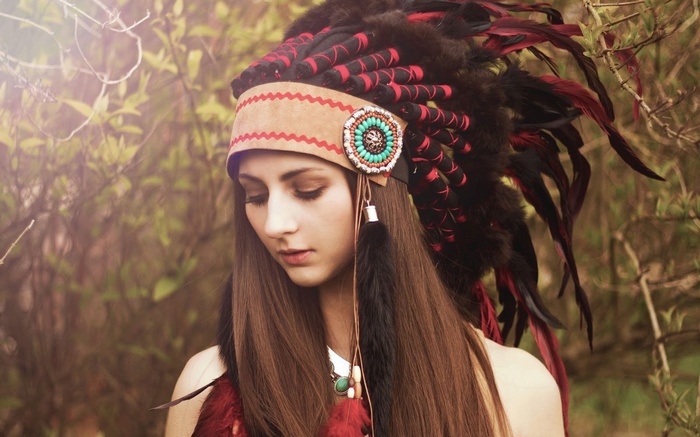 Woman wearing a Native American headdress