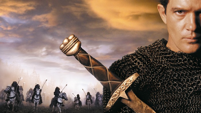 Antonio Banderas in chainmail holding a sword