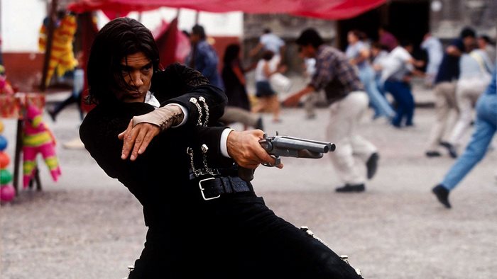 Antonio Banderas as El Mariachi with a shotgun