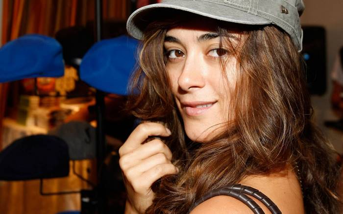 Cote de Pablo wearing a grey cap
