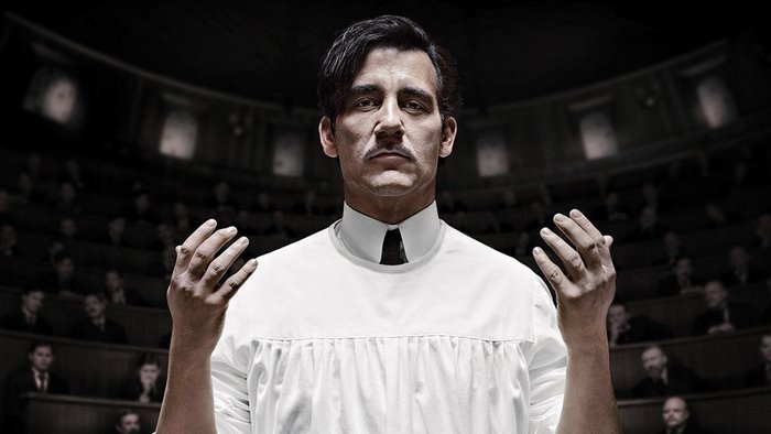 Clive Owen in a white medical gown