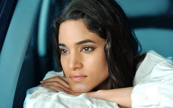 Sofia Boutella looking out a car window