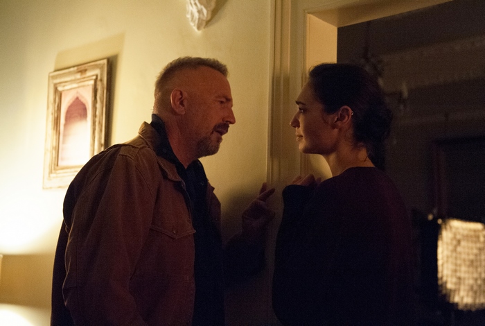 Kevin Costner and woman in room