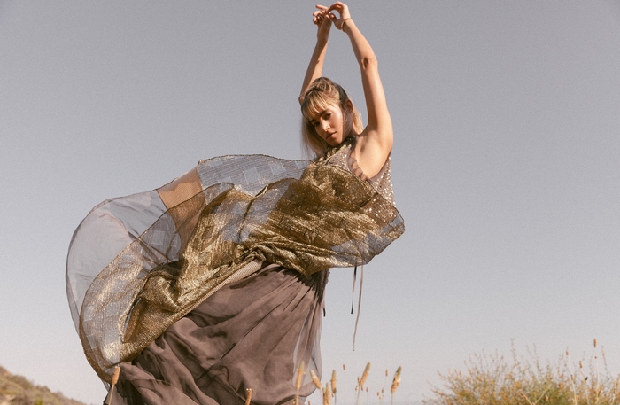 Sofia Boutella in a flowing dress outdoors
